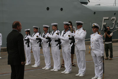 The Danish Minister of Defence is saluted by the ships Guard of Honour